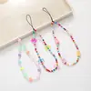 Cadena para teléfono de cuentas más vendida en colores de caramelo con diseños de oso y moño, correa para teléfono, accesorio para funda de teléfono, correa de muñeca anticaída para mujer