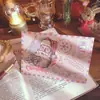 Tarjeta de felicitación navideña de piel de vaca retro, tarjeta de regalo de Navidad, linda tarjeta plegable de dibujos animados, tarjeta con mensaje de bendición con sobre