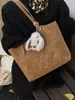 Bolsa Tote Versátil Estilo Retrô para Mulheres 2025 Inverno Novo Estilo Textura de Alto Padrão Simples Estilosa Bolsa de Ombro ou Axila