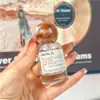 Botella dispensadora de perfume de alta gama 25 ml Botella de spray de vidrio 30 ml Botella de presión de nanorociado Botella vacía de repuesto portátil