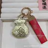 Chaveiro Diário Saco da Fortuna Ouro Puro 999 Pingente Pendurado na Bolsa do Carro Abertura para Pendurar Presente Venda por Atacado