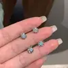 Arete de Zirconia con Forma de Concha Estrella de Cinco Puntas Brillante Acero de Titanio 316L Arete Dulce Fresco Araña de Gama Alta