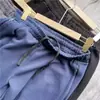 Pantalones casuales para hombre, modernos, minimalistas y deportivos, con cintura elástica, corte holgado, diseño versátil de pierna recta y cordón.