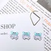 Nuevos accesorios translúcidos para decoración de uñas de cangrejo con temática oceánica, con diseños de caricaturas, estilos versátiles y decoraciones de uñas 3D ponibles y aretes de resina