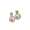 Pendientes de Perla de Circonita de Moda de Aguja Plateada Pendientes de Botón Retro de Lujo Ligero de Nicho Francés Pendientes Nuevos 2026