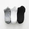 Calcetines de barco de primavera y verano calcetines para hombre calcetines para niños de boca baja invisibles color liso negro y blanco gris calcetines deportivos fabricantes al por mayor