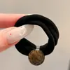 Coloridos coleteros de nuevo estilo 2026, versátiles y dulces, con accesorios de M&M's, anillos de toalla, diseños de dibujos animados y un estilo fresco y lindo, perfectos para accesorios para el cabello de niños