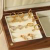 Aretes europeos y americanos de nicho de lujo ligero con exquisitos zircones, oro de 18 quilates, acero inoxidable, estrella de mar, trébol, para mujer, venta al por mayor