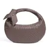 Bolso tejido de tendencia transfronteriza para mujer, bolso tipo dumpling de cuerno de color sólido texturizado, bolso de hombro de alta gama para debajo del brazo, bolso de mano de media luna