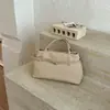Bolso tote texturizado transfronterizo para el día a día 2026 nuevo vintage simple de mano moderno versátil de gran capacidad para mujer