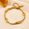 Pulsera de acero de titanio con cuentas ovaladas de hueso de serpiente en capas, europea y americana transfronteriza, que conserva el color, estilo ins, joyería de diseño de nicho de moda de doble capa