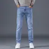 Jeans para hombre de Hong Kong 2026 nuevo otoño elásticos ajustados rectos modernos de alta gama casual de negocios pantalones largos