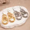 Pendientes de Gancho Redondos Geométricos Huecos Europeos y Americanos con Borlas Enroscadas, Tacto Metálico, Exagerados, de Nicho, Únicos y de Alta Gama