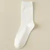 Calcetines calcetines de hombre de longitud media para las Cuatro Estaciones color liso antibacterianos combinan con todo absorbentes de sudor desodorantes calcetines de otoño calcetines negros de vestir