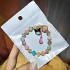 Libro Caperucita Roja Mismo Estilo Estudiante Pulsera de Glaseado de Palomitas de Maíz Hecha a Mano con Cuentas Dibujos Animados Cristal Pulsera Infantil Venta al por Mayor Cajas de Regalo