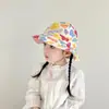 Sombrero de pescador para bebé al por mayor moda estampado pequeño fresco sombrero para el sol dos lados disponibles sombrero para niños versión coreana