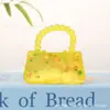 Bolso de mano de frutas Little Red Book transfronterizo, juguete de apretar con jarabe de malta para alivio del estrés y juguete de descompresión de rebote lento, venta al por mayor