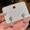 Pendientes de circón brillantes, de lujo ligero, de nicho, de alta gama, exquisitos para mujer, modernos para ir al trabajo, con colgante de gota de agua, accesorios para la oreja