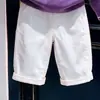 Conjunto de dos piezas para niño estilo coreano otoño 2026: suéter de punto morado calado bordado y pantalones casuales blancos para niños