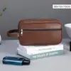 Suministros para viajes y viajes de negocios bolsa de aseo para hombre al aire libre PU bolso de mano portátil bolsa de maquillaje gran capacidad sensación de alta gama
