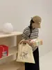 Bolsa de ombro e transversal grande com estampa inspirada no estilo ins coreano para estudantes, adequada para aula, deslocamento, uso casual, bolsa de lona versátil e artística
