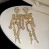 Pendientes de botón con borla de calavera incrustada de diamantes de aguja de plata transfronterizos europeos y americanos Pendientes divertidos exagerados de Halloween Adornos de oreja de diamante completo de moda para mujer