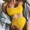Traje de baño dividido nuevo 2025 para mujer, bikini sexy de color sólido europeo y americano, traje de baño cruzado de cintura alta, venta al por mayor de bikini