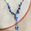 Collar con colgante de campana de mariposa de cerámica de estilo étnico retro para mujer, diseño nuevo y moderno, cadena larga para suéter, accesorios