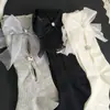 Novas meias de cano médio vazadas com strass e laço doce, meias da moda feminina, meias largas de celebridade da internet mais vendidas para primavera-verão
