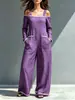Macacão de um ombro com blocos de cor para mulheres, modelo 2026, disponível em estoque, para uso transfronteiriço, corte solto com bolsos grandes, pernas largas, comprimento até o chão, macacão de alça