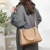 Bolso maternal modelo nuevo 2026 transfronterizo, bolso de mano liso para mujer, bolso tipo cubo versátil para ir al trabajo, elegante bolso de hombro y cruzado