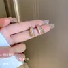 Exquisitos pendientes largos cortos con borlas incrustados de perlas y diamantes para mujer diseño de nicho de lujo ligero pendientes de lazo amor