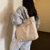 Bolsa tote casual de gran capacidad para mujer, nuevo bolso de hombro otoño 2026, bolsa de alta apariencia para estudiantes universitarios que van a clase