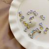 Explosiones Diamante de cristal para uñas de 5 mm Decoraciones para uñas de mariposa Nuevo taladro de fondo puntiagudo rojo neto Diamantes de imitación de color mágico transparente