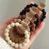 Goma elástica negra de alta elasticidad para que las mujeres se recojan el cabello en una coleta alta, accesorio para el cabello duradero y que no daña