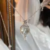 Collar elástico con colgante de estrella de cristal blanco tipo ráfaga de malla, diseño único, cadena versátil de alta gama para suéter