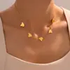 Collar con colgante de borlas irregulares transfronterizo, estilo europeo y americano, chapado en acero de titanio y oro de 18 quilates, cadena de clavícula ligera de lujo que combina con todo.