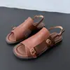 Nuevas Sandalias Romanas Retro de Verano 2026 para Mujer Hebilla Metálica Suela Plana Sin Talón Zapatos de Piel de Vaca Talla Grande Zapatos de Mujer Comercio Exterior Venta al Por Mayor