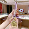 Llave de Oro Puro 999 con Forma de Moneda Colgante para Bolso de Teléfono Regalo Empresa Mayorista Reunión Anual Regalos Pequeños 40