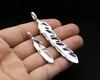 Joyería de plata esterlina S925 al por mayor Pluma retro creativa japonesa y coreana con incrustaciones de cobre ancla colgante para hombres y mujeres