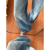 Jeans de mujer de tiro bajo, ligeramente acampanados con efecto levantamiento de glúteos, nuevo estilo verano 2026, pantalones adelgazantes retro americanos lavados tie-dye