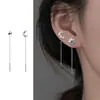 Pendientes asimétricos de estrella de cuatro puntas para mujer, elegantes y a la moda, con cadena de viento frío.