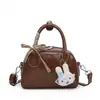 Moda Nova Primavera 2026 Simples Retrô Casual Bolsa de Mão Tendência para Trabalhador de Escritório Deslocamento Bolsa Transversal Elegante de Alto Valor