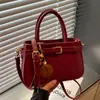 Bolso de mano de diseño nicho de moda nuevo otoño 2026 transfronterizo, bolso de hombro cruzado versátil de color liso simple y elegante