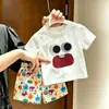 2026 Nuevo Conjunto de Verano para Niños Ojos de Dibujos Animados Lindos Manga Corta Pantalones Cortos Versátiles Súper Lindos Conjunto de Dos Piezas