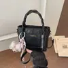 Bolso de Cubo Portátil Exquisito Versátil Estilo Coreano para Mujer 2026 Nuevo Simple Personalidad Casual Bolso de Hombro Cruzado