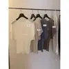 Verde limón té verde verano mujeres estilo old money simple temperamento hueco versátil casual suéter off-the-shoulder manga corta tejido top moderno