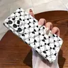 Más vendidos en Japón y Corea: Funda de teléfono elegante, minimalista y única de puntos blancos y negros con un diseño de lazo para el S25+ y el Galaxy S26