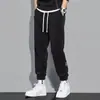 2023 nuevo caliente estilo Hong Kong otoño hombres todo partido sueltos tobillo atado pana suave marca de moda pantalones casuales hombres