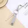 Nail Clippers chaveiro de três peças orelha escavação chave pingente cortadores de unhas conjunto de um yuan dois yuan loja de departamentos atacado